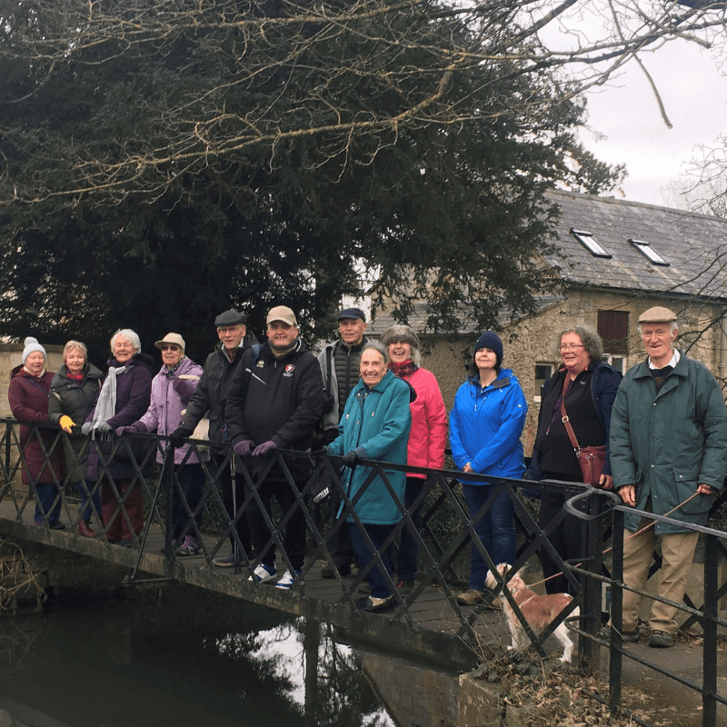 A group of walkers on the bridge in the Abbey Grounds