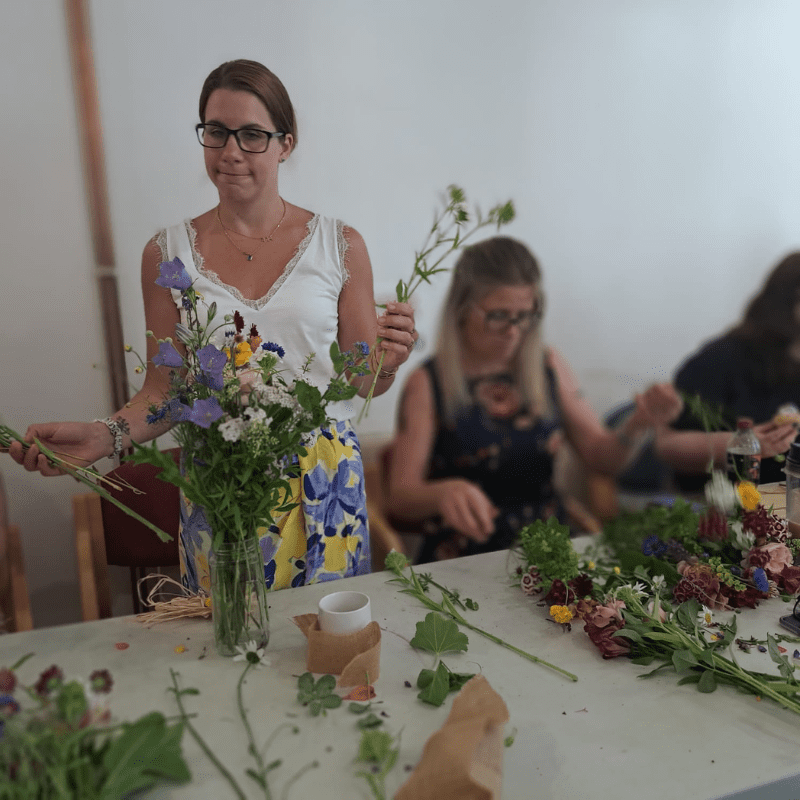 Two ladies flower arranging