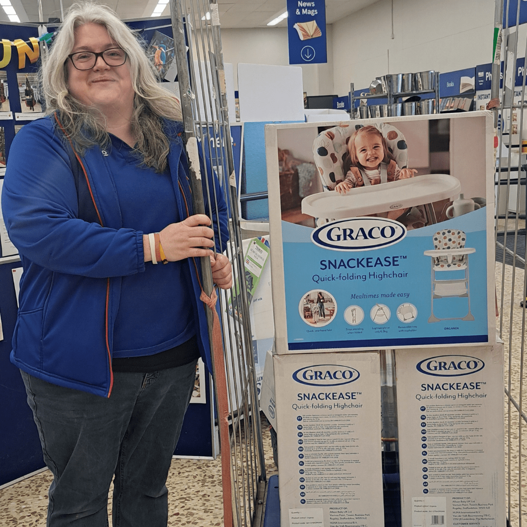 Mel Scrivens, Community Champion at Tesco Cirenceser with donations of child car seats