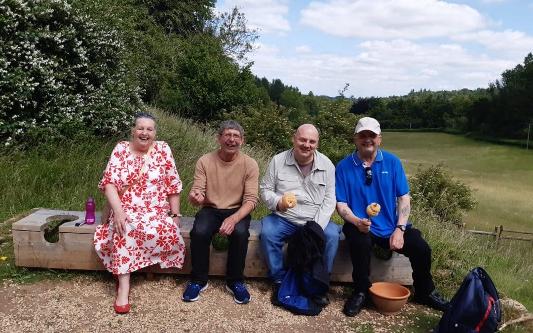 Visitors sitting on outside Roman style communal loo