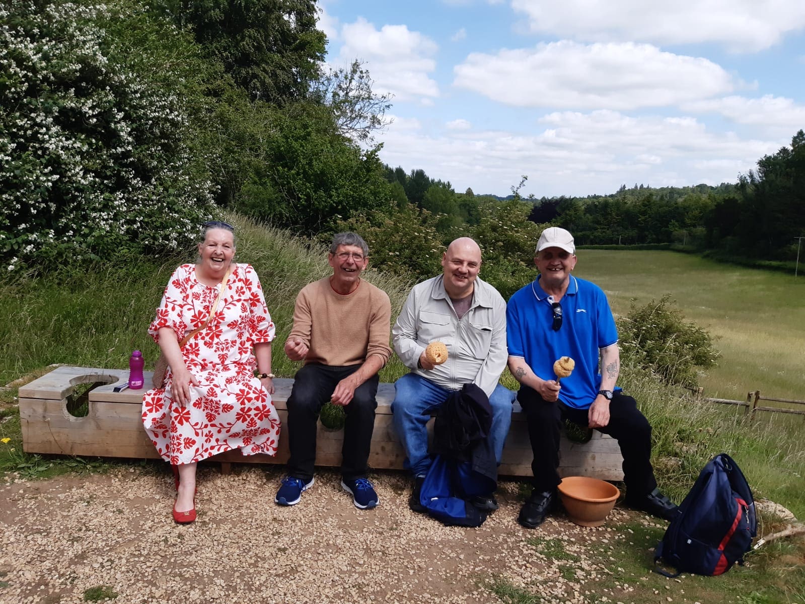 Chedworth Roman Villa Trip Visitors sitting on outside Roman style communal loo